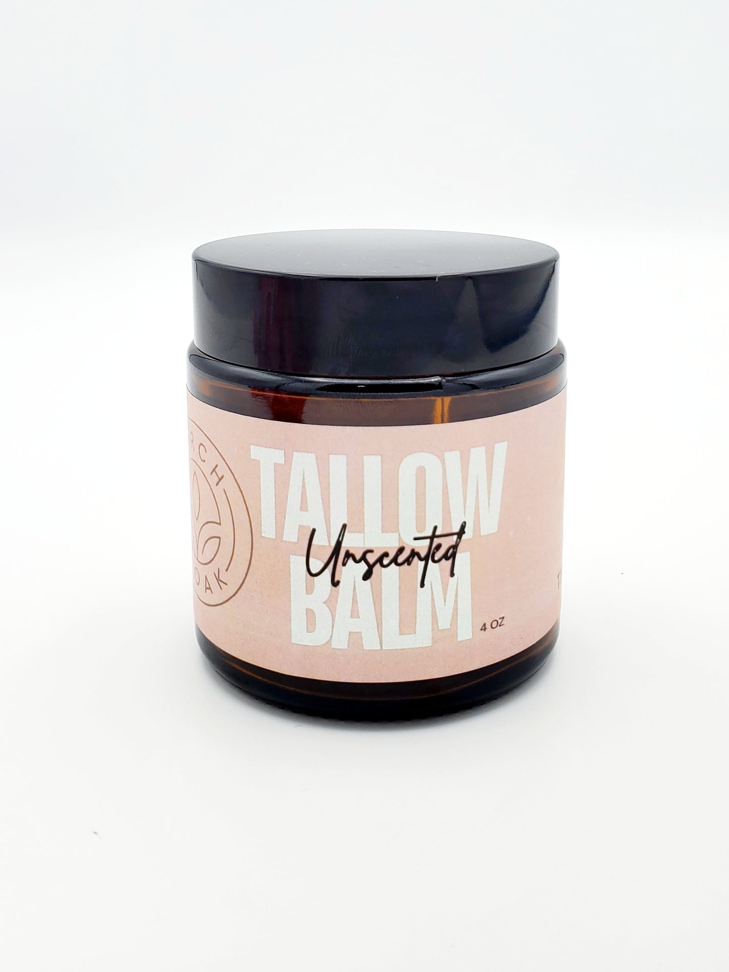 A jar of Tallow Balm Unscented skin care product with a black lid and a label that has the product name and 'KY' which likely stands for Kentucky, where it is made.