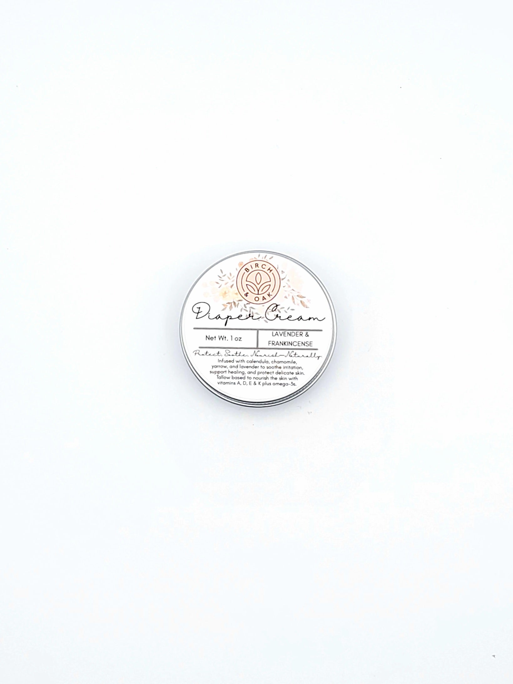 Round container of diaper cream on a white background