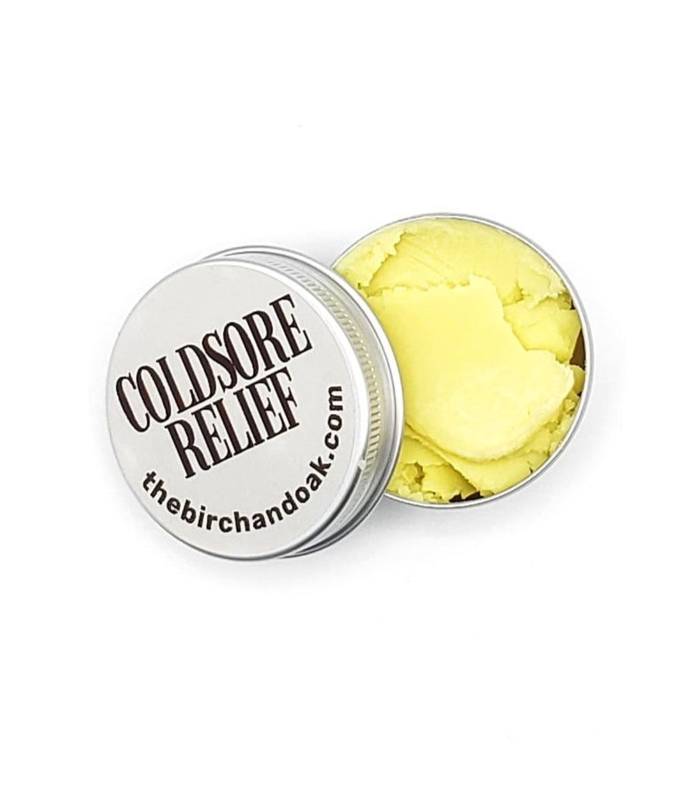 Coldsore relief product with yellow gel in a round container on a white background