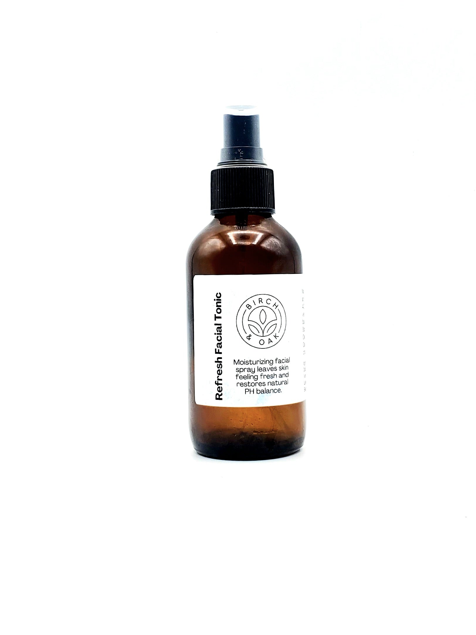 Brown glass bottle with a black cap on a white background