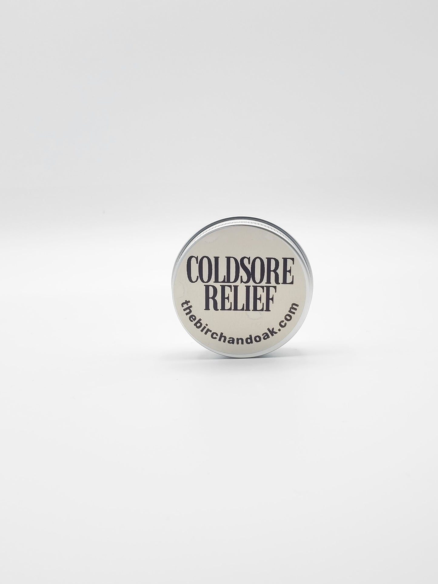 Coldsore relief product with 'thebirchanddak.com' branding on a white background